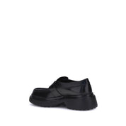 Tod's Black Rubber Platform Loafers